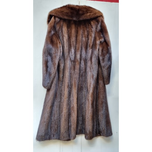 353 - Star Lot : A beautiful genuine mink fur coat. From Saga Mink. In very good condition. Approx size UK... 