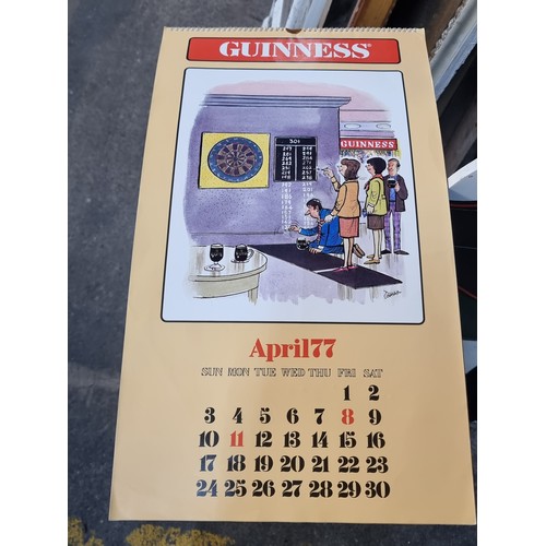 120 - A super retro Guinness branded wall calendar dating to 1977 featuring comical illustrations by T. Gr... 