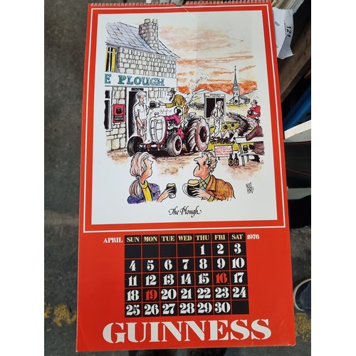 121 - A super retro Guinness branded wall calendar dating to 1976 featuring comical illustrations by Noel ... 