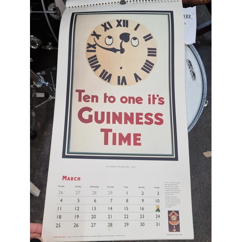 122 - A super retro Guinness branded wall calendar dating to 1996 featuring advertising heritage throughou... 