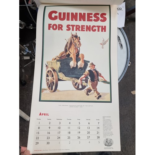 122 - A super retro Guinness branded wall calendar dating to 1996 featuring advertising heritage throughou... 