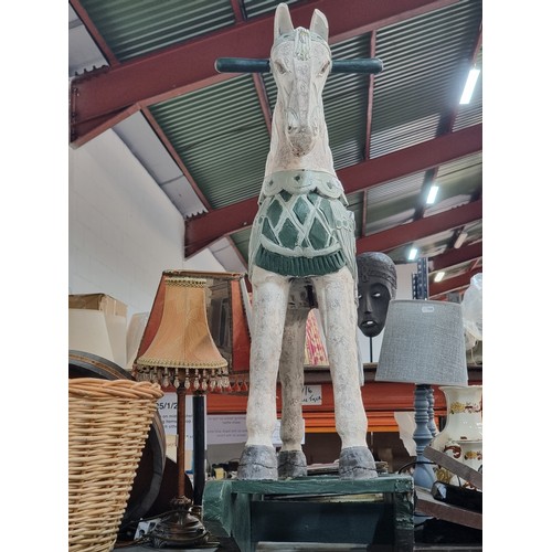 382 - Star lot : A very charming wooden rocking horse boasting great detail and floral appliques. This is ... 