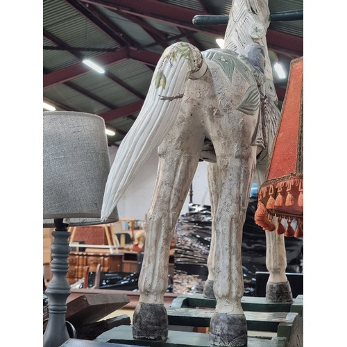 382 - Star lot : A very charming wooden rocking horse boasting great detail and floral appliques. This is ... 