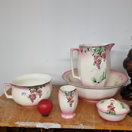 211 - Five fabulous pieces of porcelain all decorated in a colourful floral pattern. Including a large jug... 