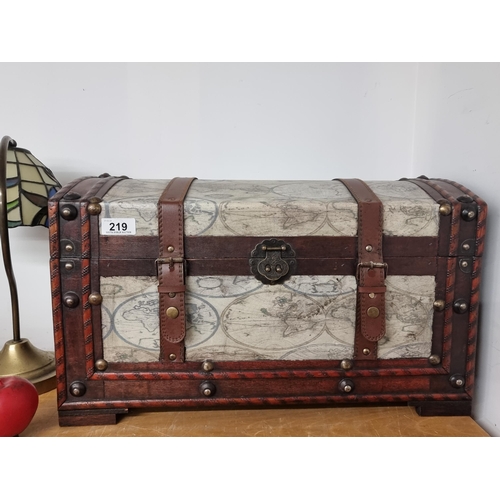 219 - A stylish contemporary dome top trunk featuring a canvas atlas scene.