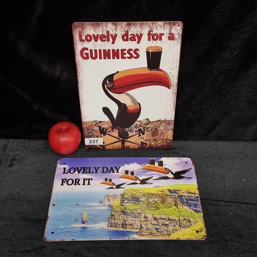 237 - Two metal Guinness advertising pub signs. Including the iconic Toucan and Toucans flying over the cl... 