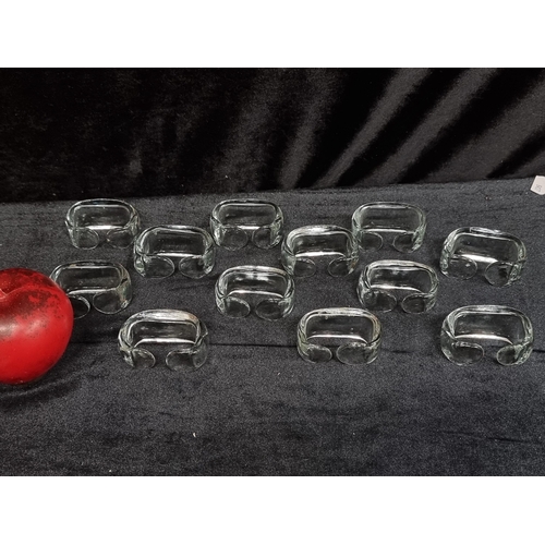 256 - A collection of 12 handblown Swedish  glass napkin rings. In very good condition.