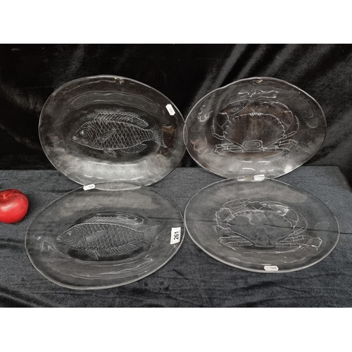 261 - A impressive collection of four Kosta Boda Sweden, Marina glass serving platters designed by Goran a... 