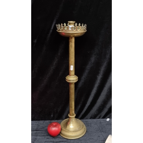 270 - A large antique ecclesiastical brass altar candlestick. With lovely castle style wax catcher.