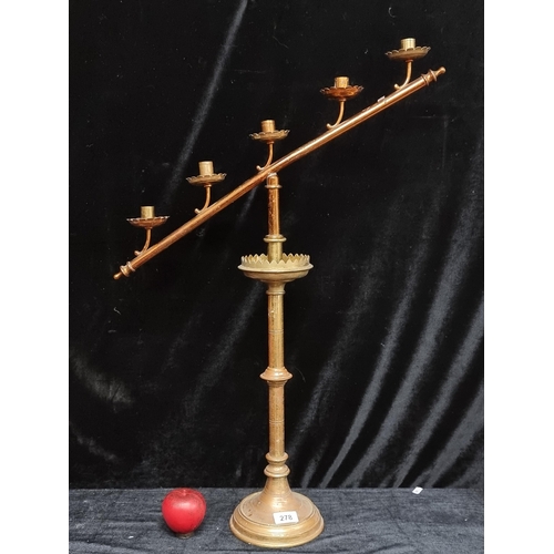 278 - A large antique ecclesiastical brass altar candelabra.