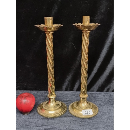 285 - A pair of polished  antique ecclesiastical twisted stem brass candlesticks. Lovely pair. With lovely... 