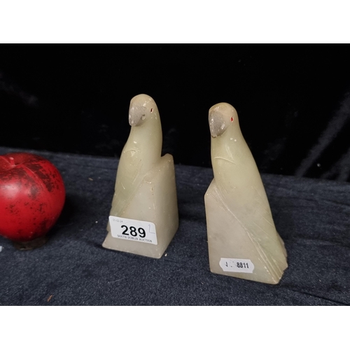 289 - A stunning pair of Italian Scaglione alabaster Parrot book ends. Featuring piercing cherry red glass... 