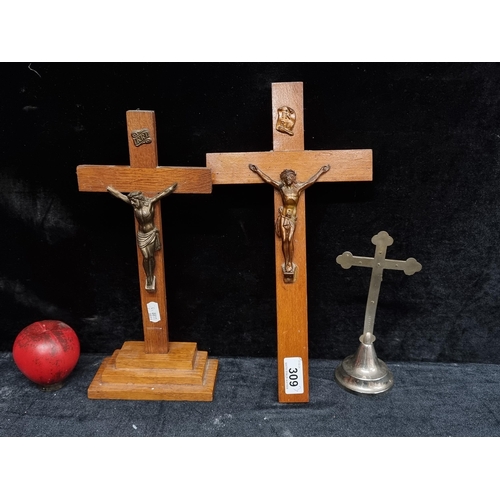 309 - Three vintage crucifixes including two wooden examples and a metal German example.