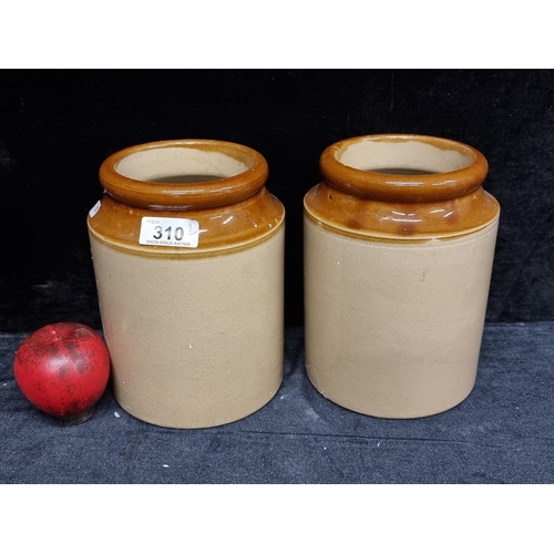 310 - A pair of vintage stoneware pots.