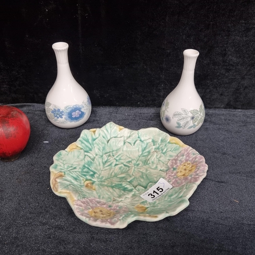 315 - Three porcelain and ceramic items including two Wedgwood bud vases in the Clementine pattern and a s... 