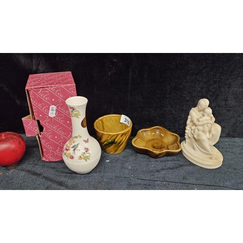 316 - A mixed lot including a Achill studio pottery coffee cup and saucer, a wax Madonna and Child figurin... 