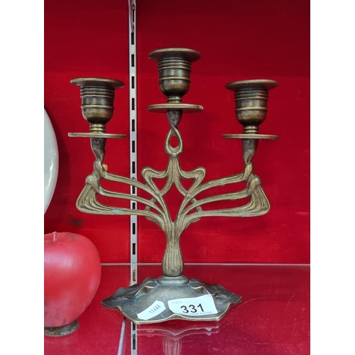 331 - An elegant cast metal Art Nouveau style candelabra with three branches. With classic natural world o... 