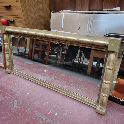 350 - A gorgeous antique large over mantle mirror housed in style gold gilt frame.