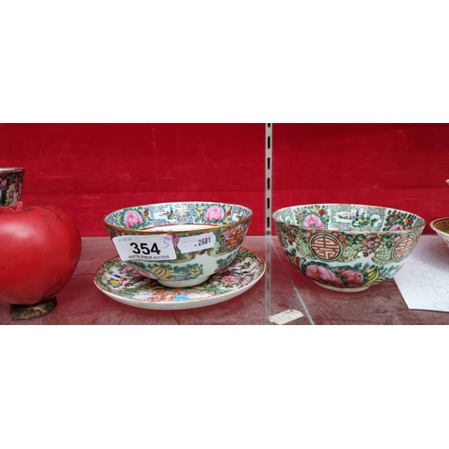 354 - Two antique Chinese Famille rose cups along with a matching saucer. In very good condition.