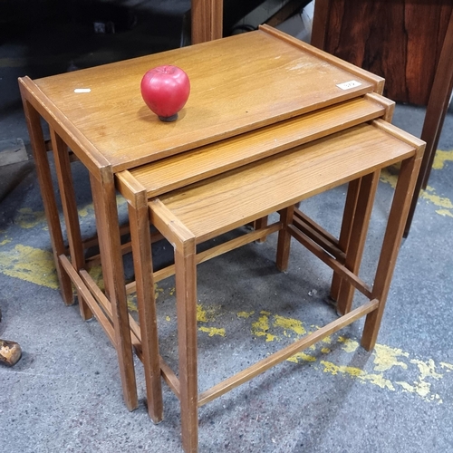 372 - A lovely set of mid century nesting tables in a nice light teak wood. 
Great Scandi look.