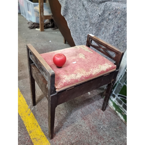 404 - A charming early 20th century piano stool with storage under seat. Some wear and tear to seat. From ... 