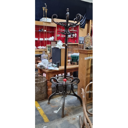 406 - A fabulous large antique bentwood coat hanger with six hooks and umbrella stand base. Slight losses ... 