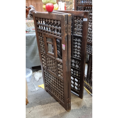 412 - Star Lot : An elegant antique three panel wooden bedroom screen with intricate turned detailing. Som... 