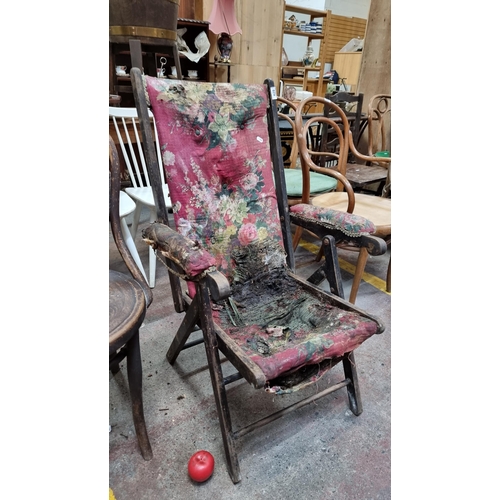 429 - A charming Victorian armchair with floral upholstery. A restorer's dream.  From the stables of the a... 