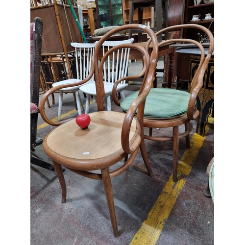 431 - A pair of wonderful early 20th century bent wood chairs with arm rests.  From the sunroom of the ama... 