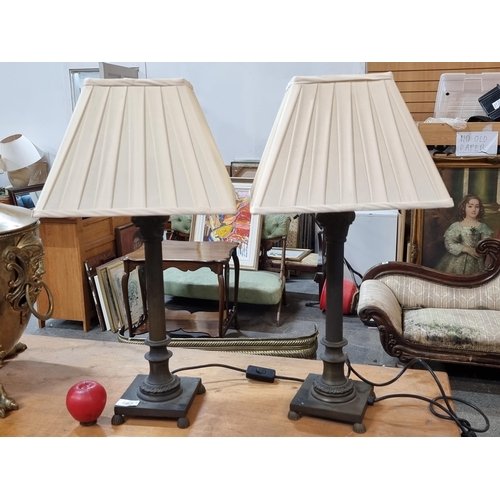 467 - A stylish pair of heavy cast metal base Grecian column style table lamps with square pleated shades ... 