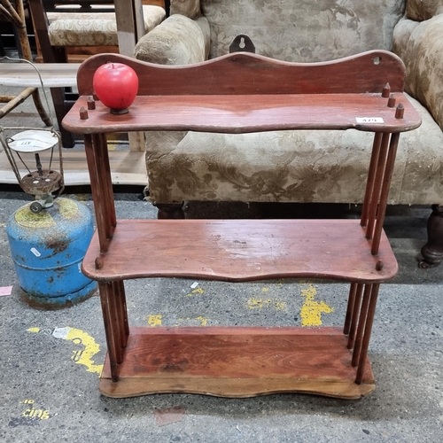 479 - A wonderful Victorian three tier shelving unit featuring a gallery back and room for hanging plates.... 