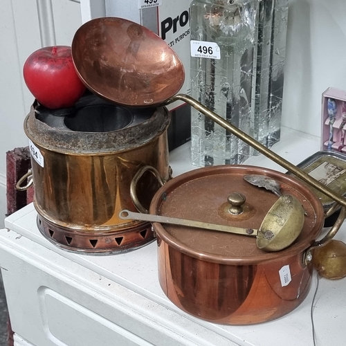 494 - Four antique copper and brass items including a large ladle and a double handled pot. Very attractiv... 