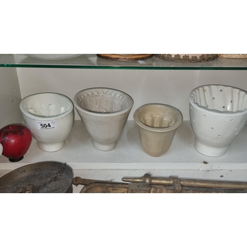 504 - A fantastic selection of three 19th century  stoneware jelly molds along with a steamed pudding mold... 