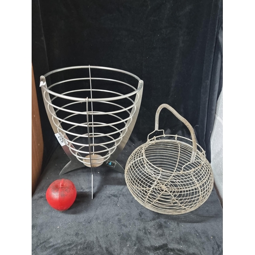 522 - Two items including a German made Zack fruit bowl and an earlier wire basket.  From the amazing, Mon... 