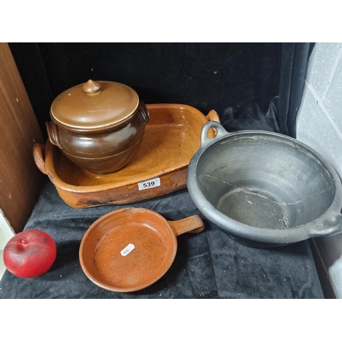 539 - Four high quality kitchenware items including a large terracotta double handled baking dish etc.