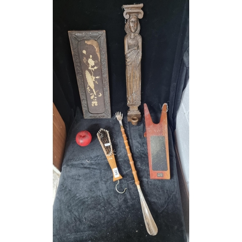 542 - A selection of five wooden vintage items including an unusual boot remover, a large shoe horn with b... 