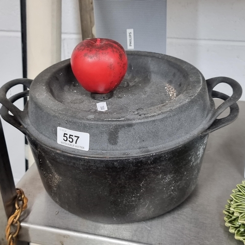 557 - A superb vintage cast iron lidded pot with the text 