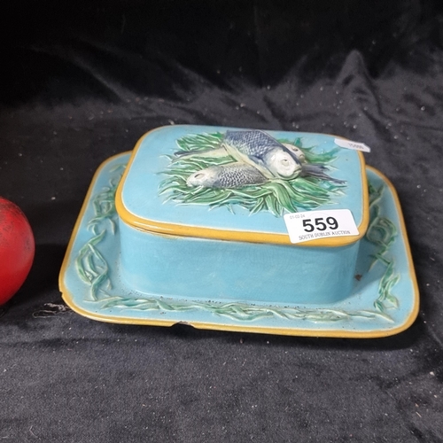 559 - A fantastic Majolica 19th century colourful ceramic butter dish decorated with fish to the lid. chip... 