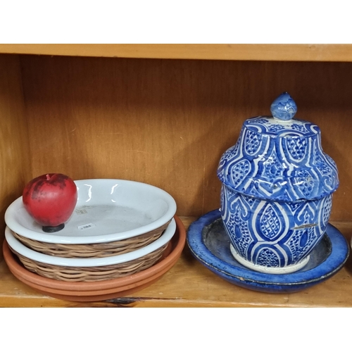 582 - A lovely hand thrown lidded ginger jar in a blue and white pattern with associated plate, along with... 