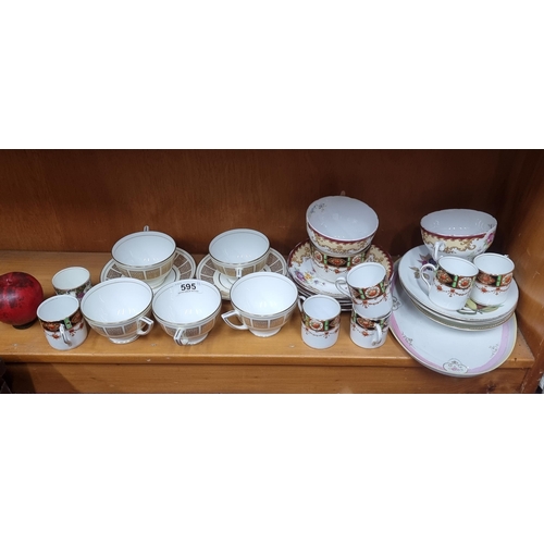 595 - A collection of fine bone china by brands such as Aynsley, Minton, Royal Tuscan and Roslyn China. Fe... 