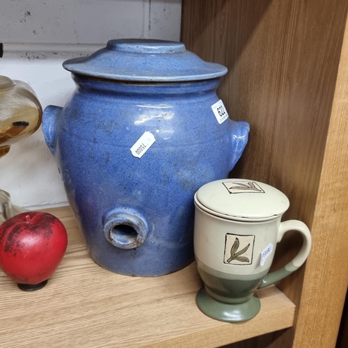 622 - Two ceramic items including a very large blue ceramic canister  with a lid and drainage hole to side... 