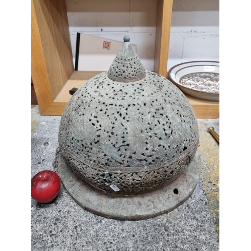 627 - A large vintage Moroccan brass pendant planter with intricate floral design.