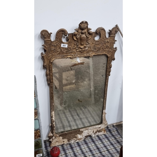 661 - A late 19th Century Rococo style gilt framed mirror. Some loss to base of molding but still beautifu... 