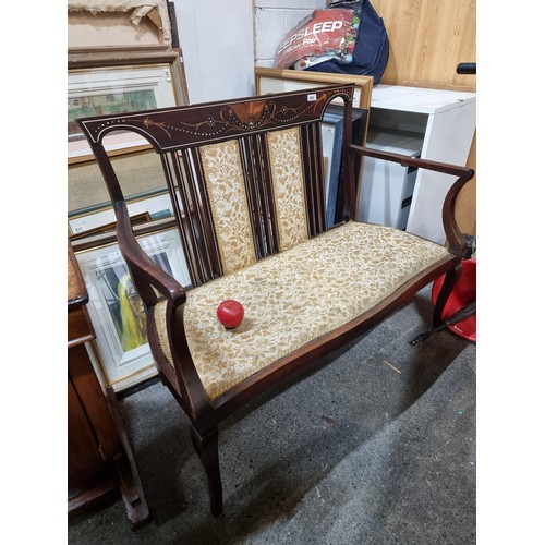 485 - Star Lot : A gorgeous Edwardian mahogany two-seater bench boasting intricate foliate marquetry, moth... 