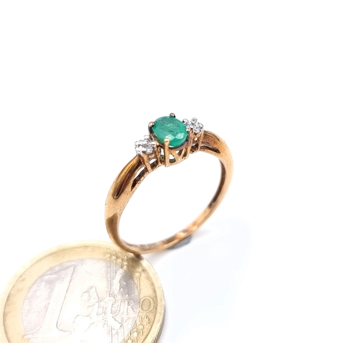 674 - Star Lot : A super pretty emerald and diamond 9K gold ring, size O, weight 1.68 grams.