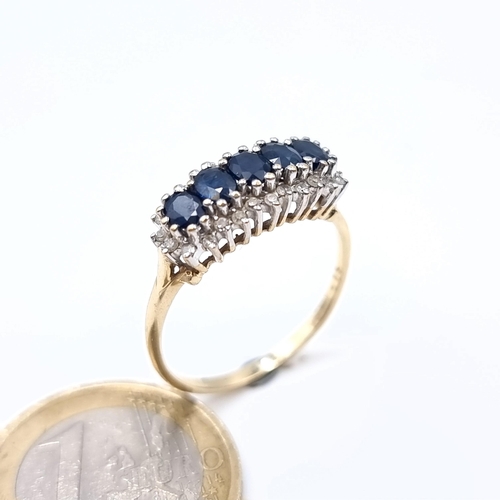 686 - Star Lot : A stunning example of a five stone sapphire ring with diamond mount, diamond stamped to b... 