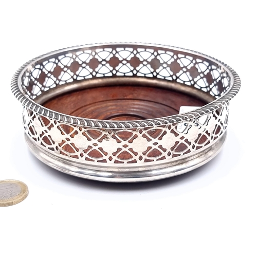 698 - A good quality large wine/champagne coaster with lattice design and ribbed finish with polished wood... 