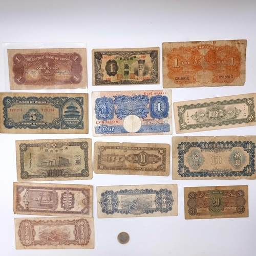 704 - A collection of vintage 10 Chinese bank notes and a vintage £1 Bank of England bank note