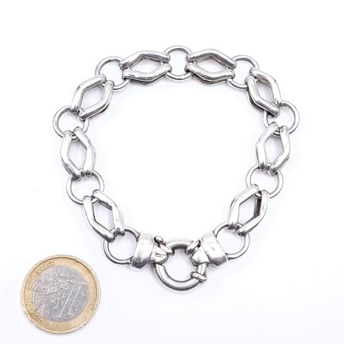 723 - A sterling silver chain linked bracelet, weight 19.9 grams.