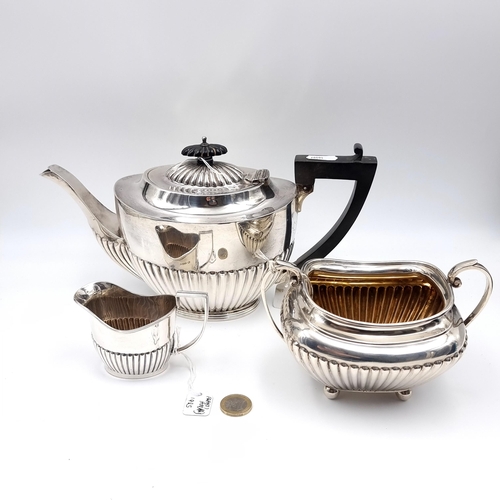 726 - Star Lot . Three piece sterling silver tea set consisting of tea pot with ebonized handle hallmarked... 